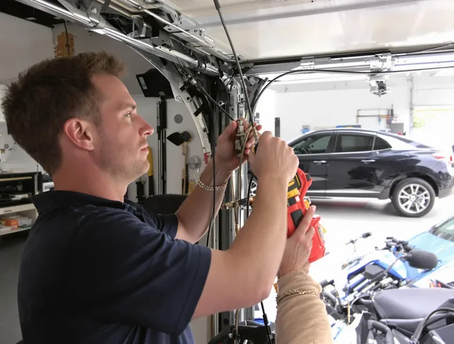 East Los Angeles Garage Door Repair safety certified technician performing cable replacement in East Los Angeles