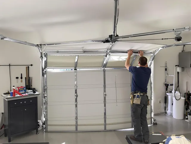 East Los Angeles Garage Door Repair specialist performing precise section replacement on East Los Angeles garage door